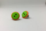 Green-on-orange button earrings